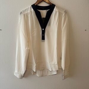 Chic White Blouse with Black Trim by Merritt Charles